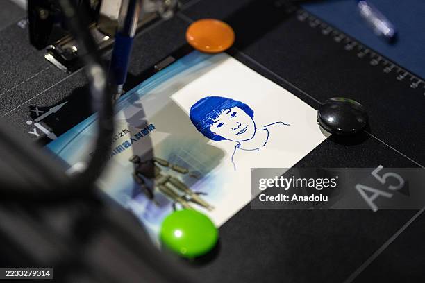 Painting robot is seen during the Artificial Intelligence Robot Exhibition on September 6,2025 in Guangzhou, Guangdong Province of China.The...