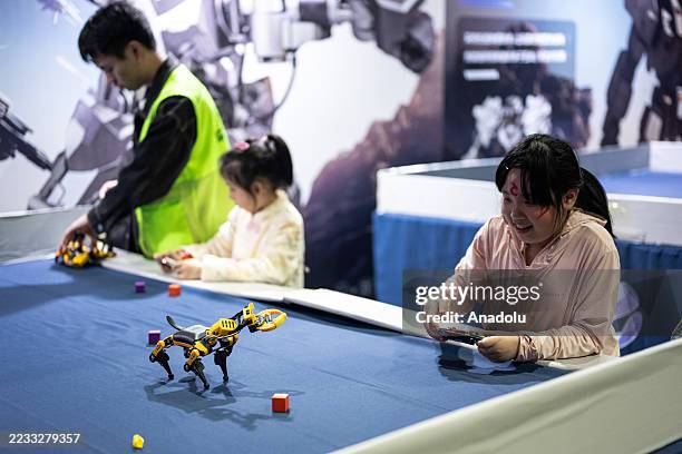 Audience controls biomimetic robot during the Artificial Intelligence Robot Exhibition on September 6,2025 in Guangzhou, Guangdong Province of...