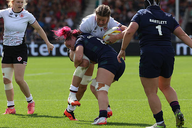 Canada's lock Sophie de Goede is tackled by Scotland's number 8 Evie Gallagher during the Women's Rugby World Cup pool B match between Canada and Scotland at Sandy Park