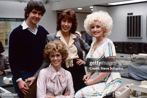 Portrait of, from left, Australian-American film director Colin Higgins , and American actors Jane Fonda , Lily Tomlin , and Dolly Parton on the set...