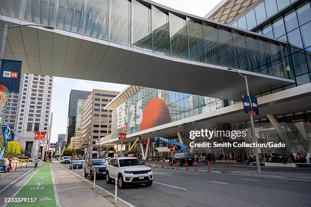 Glass skybridge and South Entrance at Moscone Center South with event banners and cars on Howard Street, San Francisco, California, August 29, 2025.