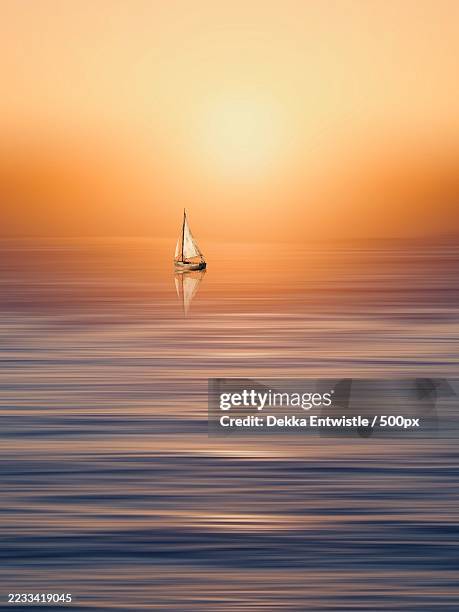 sailboat silhouette on tranquil sea at sunset,sunshine coast,australia - golden hour stock pictures, royalty-free photos & images