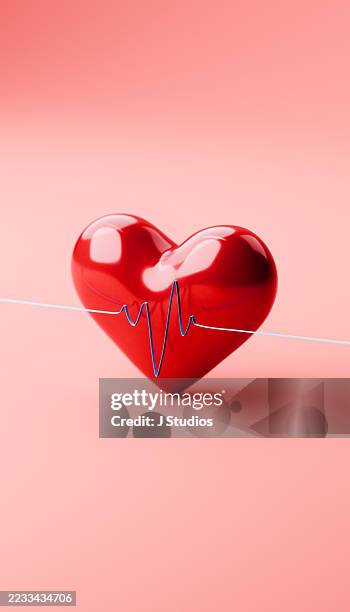 reflective red heart with diagonal ecg line graph - taking pulse stock pictures, royalty-free photos & images