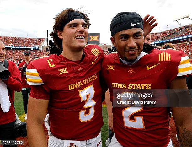 Quarterback Rocco Becht of the Iowa State Cyclones celebates with teammate defensive back Jamison Patton of the Iowa State Cyclones after defeating...