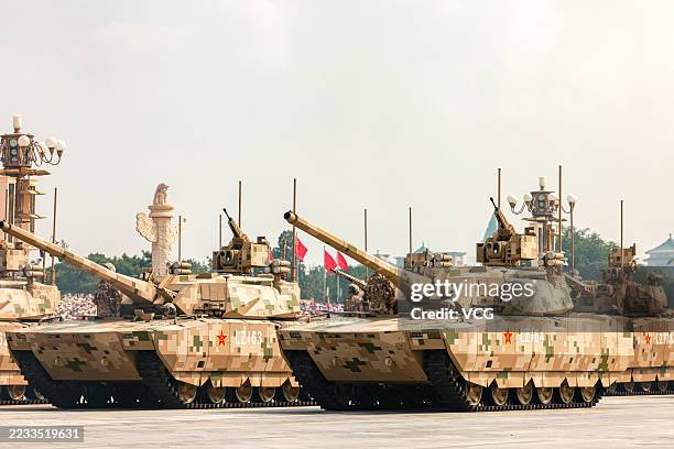 Type-100 tanks of the ground assault formation are reviewed during the V-Day military parade on September 3, 2025 in Beijing, China. China unveiled...