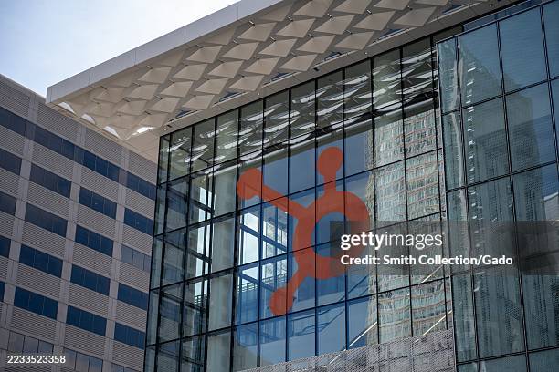 Glass facade of Moscone Center in San Francisco, California with Hubspot logo displayed, August 29, 2025.