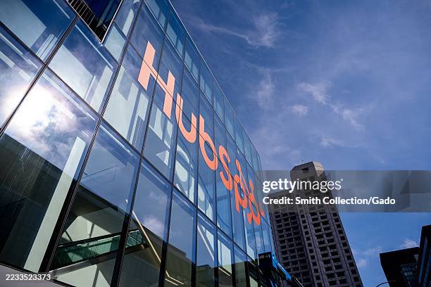 Glass facade of Moscone Center in San Francisco, California with Hubspot logo displayed, August 29, 2025.