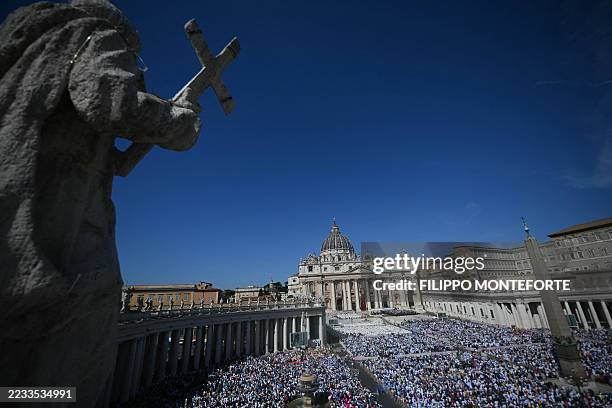 Faithful gather as they attend a Holy Mass and canonisation of Blessed Carlo Acutis and Pier Giorgio Frassati in St Peter's Square at the Vatican on...