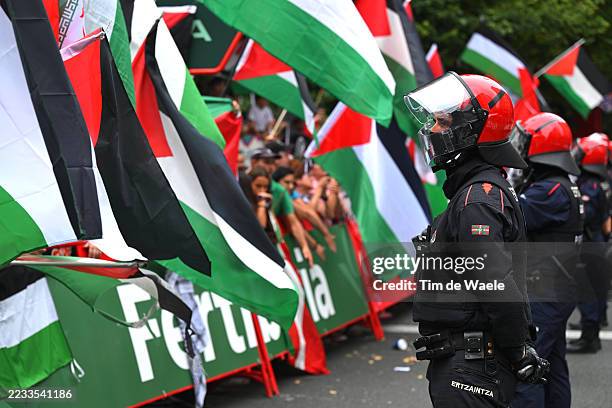 Pro-Palestinian protesters at the finish line watched by the police during the La Vuelta - 80th Tour of Spain 2025, Stage 11 a 157.4km stage from...