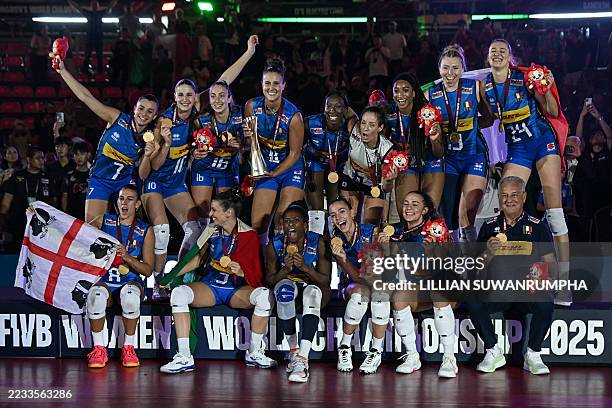 Team Italy pose with their gold medal after winning the final match against Turkey in the 2025 Women's Volleyball World Championships in Bangkok on...