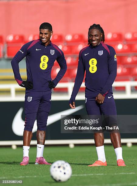 Marcus Rashford and Eberechi Eze of England react during a training session at St George's Park on September 03, 2025 in Burton upon Trent, England.