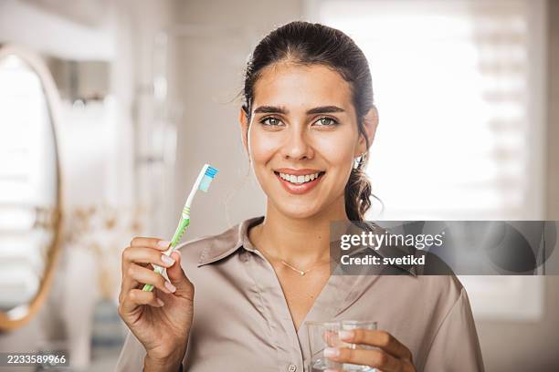 morning routine in bathroom - brushing teeth stock pictures, royalty-free photos & images