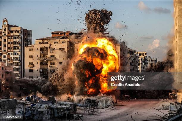 Flames and smoke rise from the building following the Israeli army bombs the al-Ruya Tower in Gaza City, Gaza, on September 07, 2025.