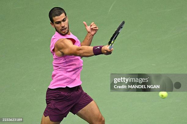 Spain's Carlos Alcaraz plays a forehand return to Italy's Jannik Sinner during the men's singles final tennis match on day fifteen of the US Open...