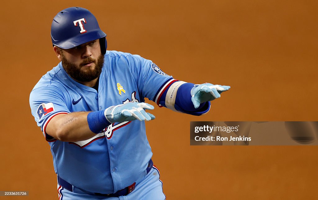 Texas Rangers Latin Jake Burger of the Texas Rangers celebrates after hitting a single ...