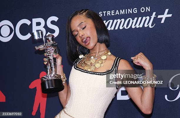 South African singer-songwriter Tyla poses in the press room with the Best Afrobeats award "PUSH 2 START" during the MTV Video Music Awards at UBS...