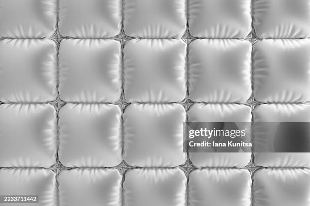 abstract 3d monochrome background with white, gray, silver padded squares resembling soft cushions or quilted fabric. modern geometric texture with glossy lighting and shadows, perfect for design, luxury, and decorative concepts. - jacket stock pictures, royalty-free photos & images