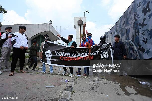 Protesters clash with police outside the Parliament in Kathmandu, Nepal, on September 8 as thousands of youths rally against the government's social...