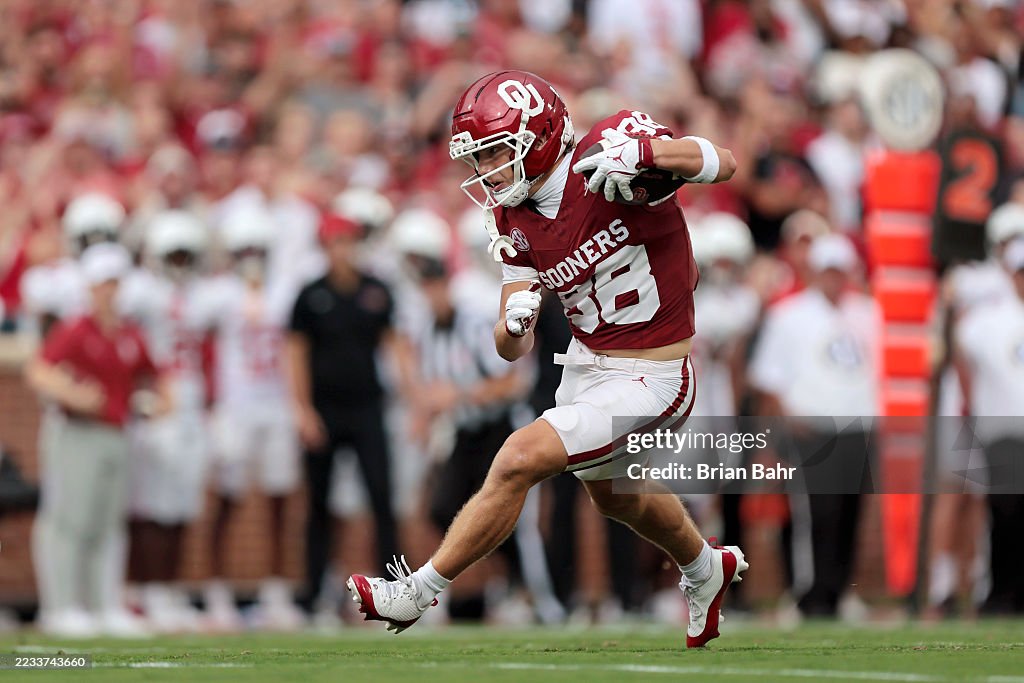 Jacob Jordan Wide receiver Jacob Jordan of the Oklahoma Sooners cuts his way to a ...