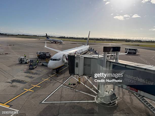 Plane is at Manchester Airport.