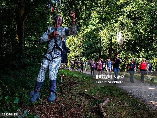 Reenactors perform along the route for participants walking in the 78th edition of the Airborne walking march, which is also in remembrance of the...
