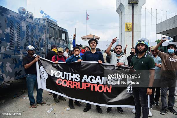 Gen Z protesters clash with police after breaking barricades outside the parliament house at the Federal Parliament in Kathmandu, Nepal, on September...