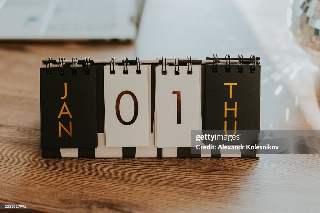 Desktop Flip Calendar Displaying January First in Golden Letters