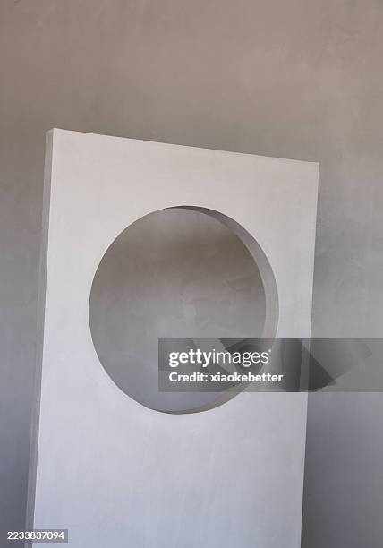 minimalist white wall with circular cutout - hollow stock pictures, royalty-free photos & images