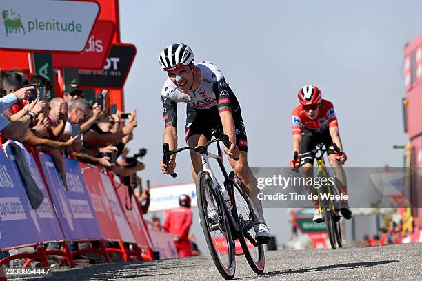 Joao Almeida of Portugal and UAE Team Emirates - XRG crosses the finish line as stage winner ahead of Jonas Vingegaard of Denmark and Team Visma |...