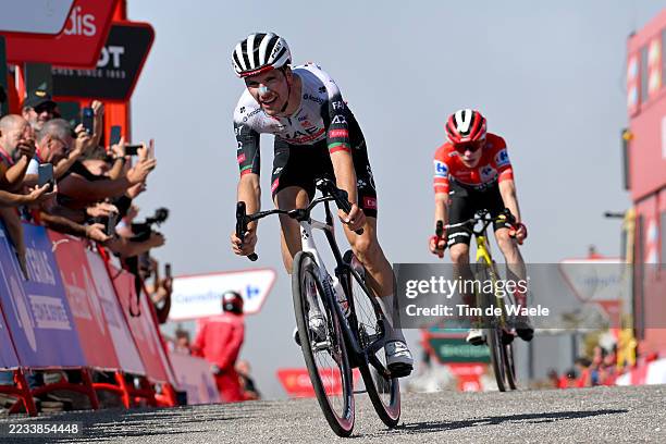 Joao Almeida of Portugal and UAE Team Emirates - XRG crosses the finish line as stage winner ahead of Jonas Vingegaard of Denmark and Team Visma |...