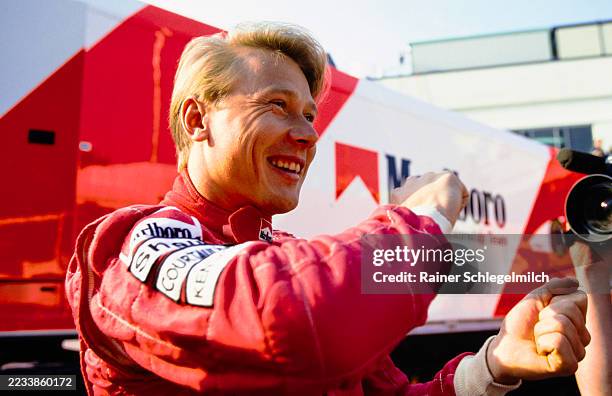 Smiling Mika Häkkinen demonstrates steering through a slide at the San Marino Grand Prix at Autodromo Enzo e Dino Ferrari, Imola, Italy, 29th...
