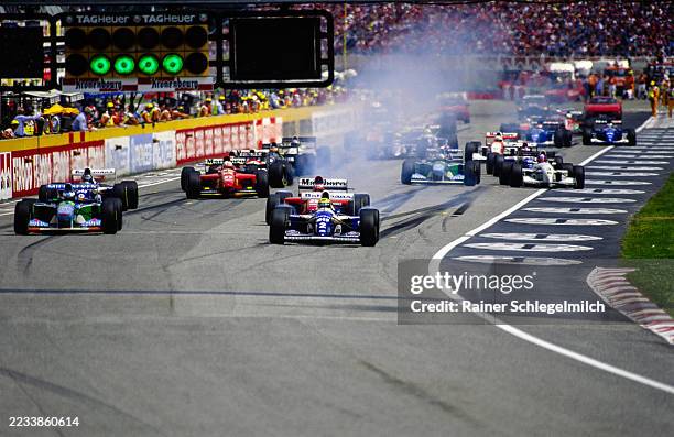 The start of the race. At centre right, cars take evasive action around the stranded Benetton B194 of JJ Lehto at the San Marino Grand Prix at...