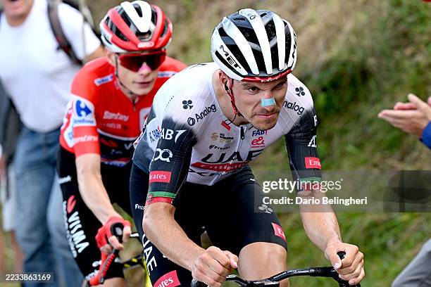 Jonas Vingegaard of Denmark and Team Visma | Lease a Bike - Red Leader Jersey and stage winner Joao Almeida of Portugal and UAE Team Emirates - XRG...