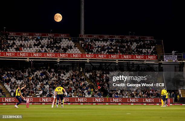 General view of play as the moon can be seen during the Men's Vitality Blast match between Durham Cricket and Hampshire Hawks at Banks Homes...