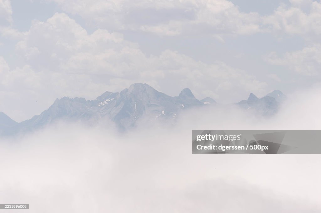Misty Mountain Peaks Under a Cloudy Sky