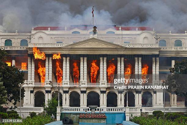 Fire rages through the Singha Durbar, the main administrative building for the Nepal government, in Kathmandu on September 9 a day after a police...