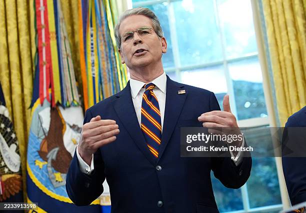 Treasury Secretary Scott Bessent speaks as U.S. President Donald Trump announces plans to host the 2026 G20 summit in Miami, Florida during a press...