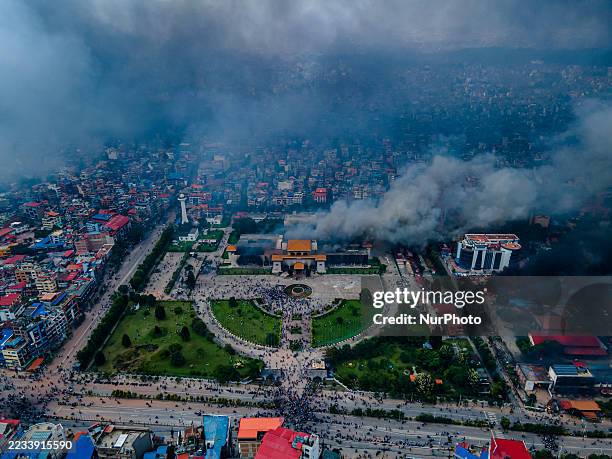 The aerial view shows demonstrators setting fires at public buildings in many places, including the Parliament building, across the Kathmandu,...