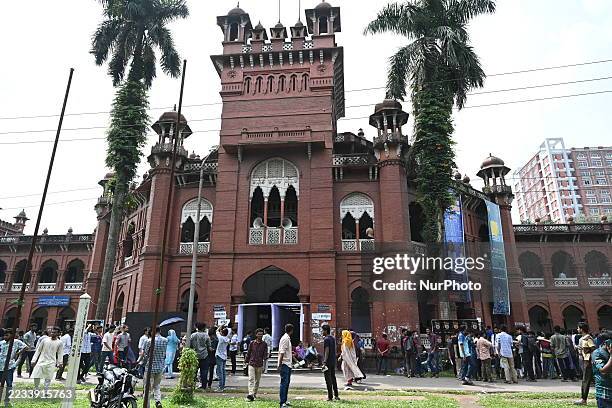 Student voters wait to cast their votes in a queue at a polling station during the Dhaka University Central Students' Union election day at Dhaka...