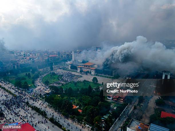 The aerial view shows demonstrators setting fires at public buildings in many places, including the Parliament building, across the Kathmandu,...