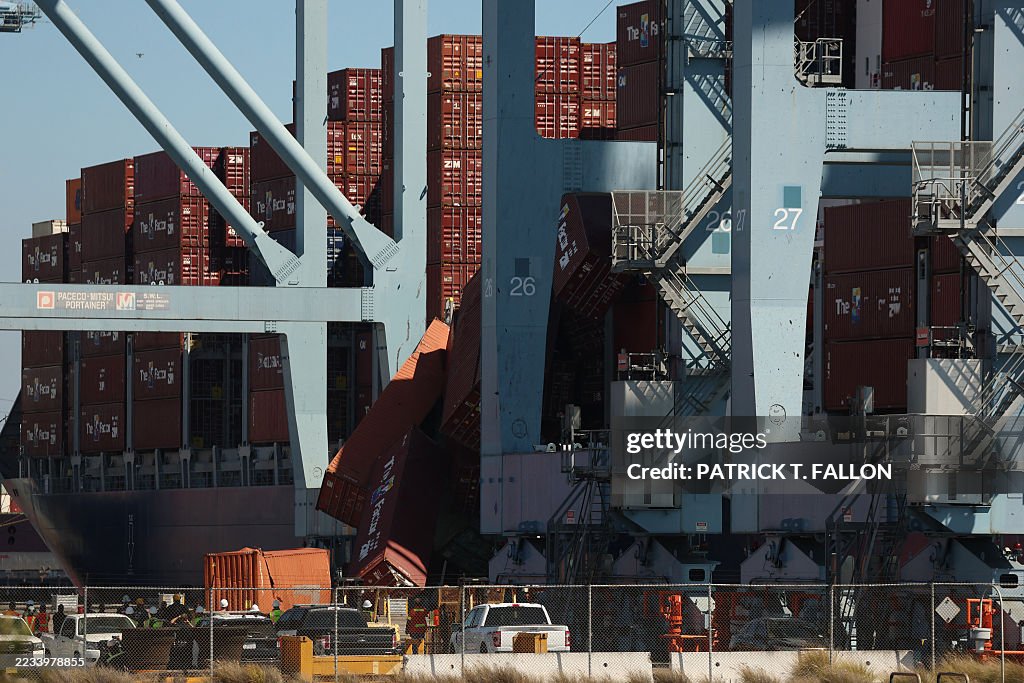 Container Dropped Fallen shipping containers are seen next to a vessel moored at the ...