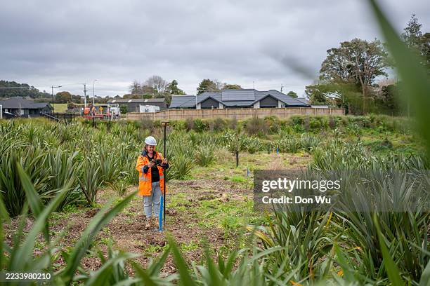 surveyor measuring land with gps equipment - surveyor stock pictures, royalty-free photos & images