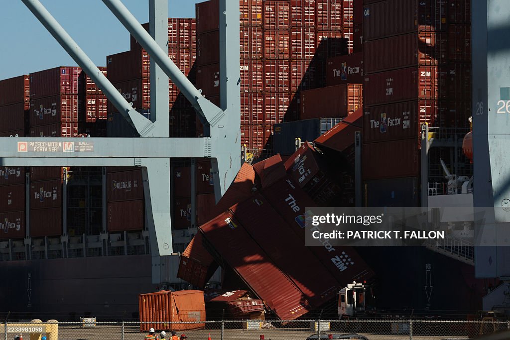 Port Container Disaster Fallen shipping containers are seen next to a vessel moored at the ...