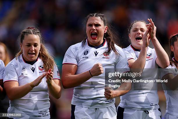 Gabriella Cantorna, Ilona Maher and Emily Henrich of the USA react as they sing their national anthems prior to the Women's Rugby World Cup 2025 Pool...