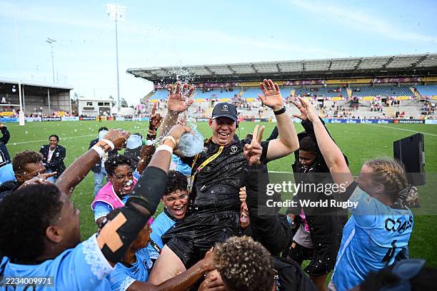 Ioan Cunningham, Head Coach of Fiji, is lifted by his players in celebration following the team's victory in the Women's Rugby World Cup 2025 Pool B...
