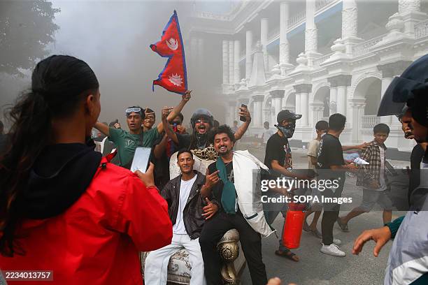 Youths celebrate after capturing Singha Durbar, which housed the office of the former Prime Minister and other ministries, amid raging Gen Z protests...