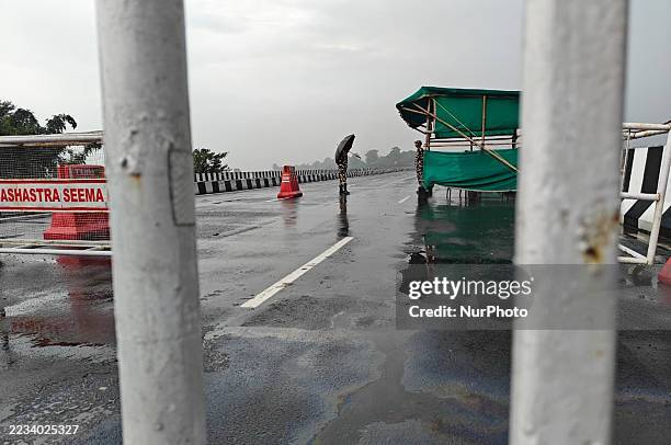 Indian Sashastra Seema Bal personnel keep vigil at the Mechi River Bridge, which lies between the India-Nepal border in the Panitanki area on the...