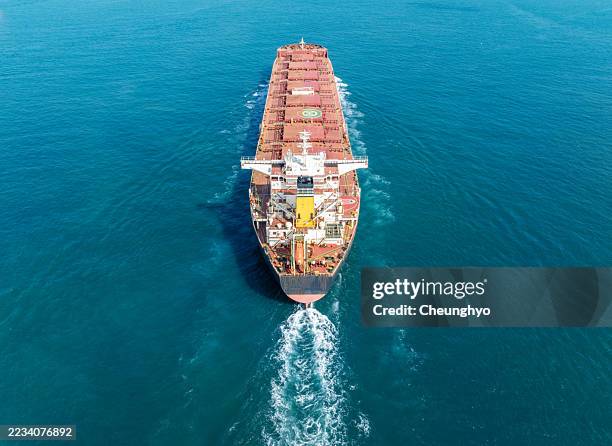 drone aerial view of a bulk carrier at sea - bulk carrier stock pictures, royalty-free photos & images