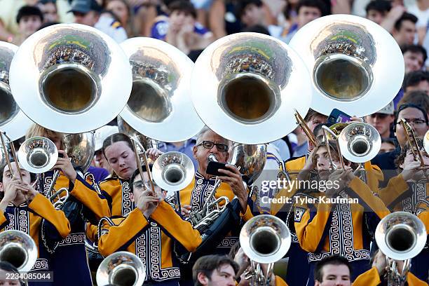 Kent Broussard, the oldest member of the LSU Tiger Band in history, plays the tuba during the first half of the game against the Louisiana Tech...