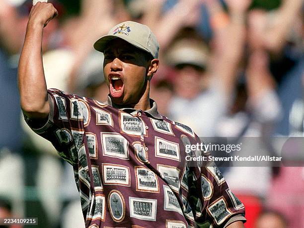 September 26: Tiger Woods of United States celebrates chipping in on the 8th Green on Day Three of 33rd Ryder Cup Matches at The Country Club In...